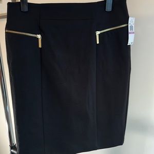 Black Michael Kors skirt. Size 6. NEW. Gold zippers. Zipper pockets, split